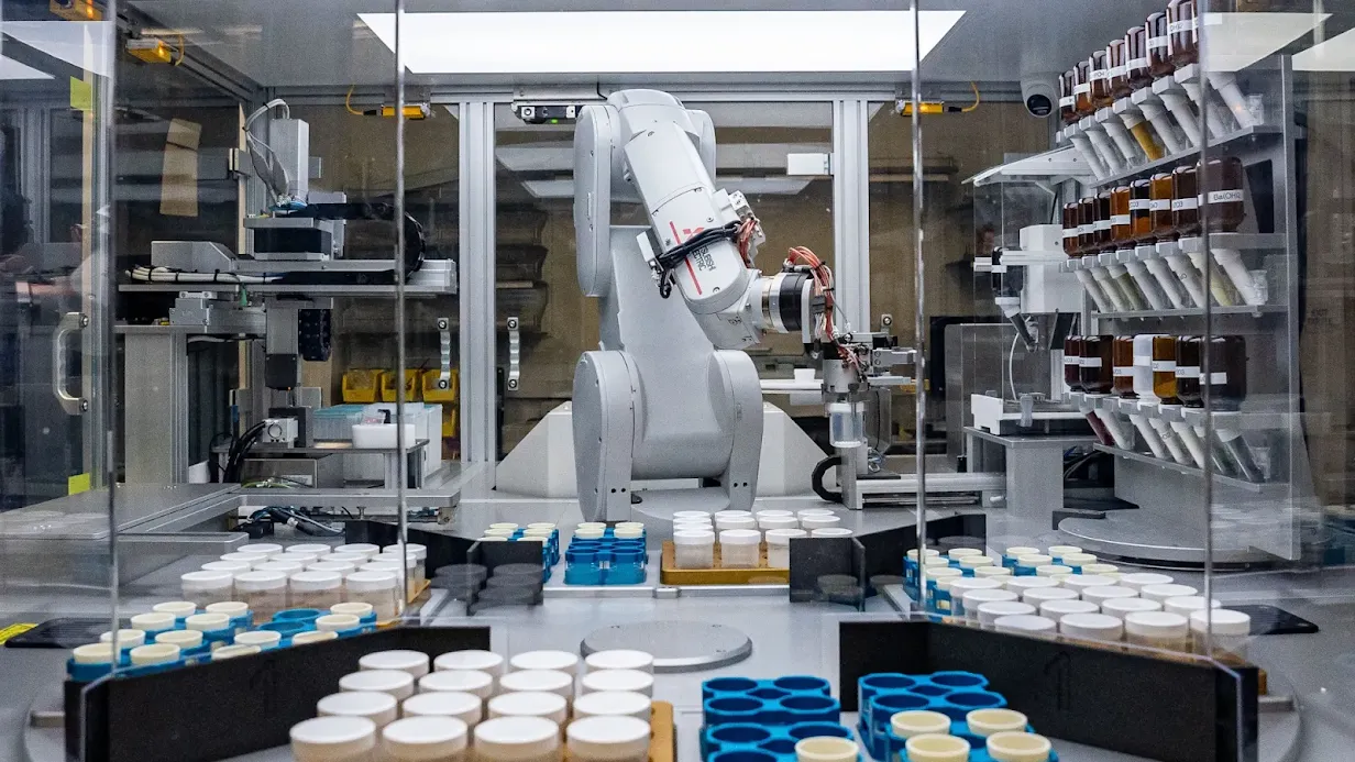 A robotic arm at synthesising new materials in a lab