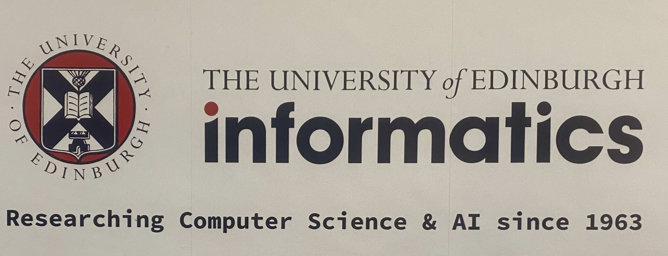 A wall in the University of Edinburgh's School of Informatics stating their research began in 1963